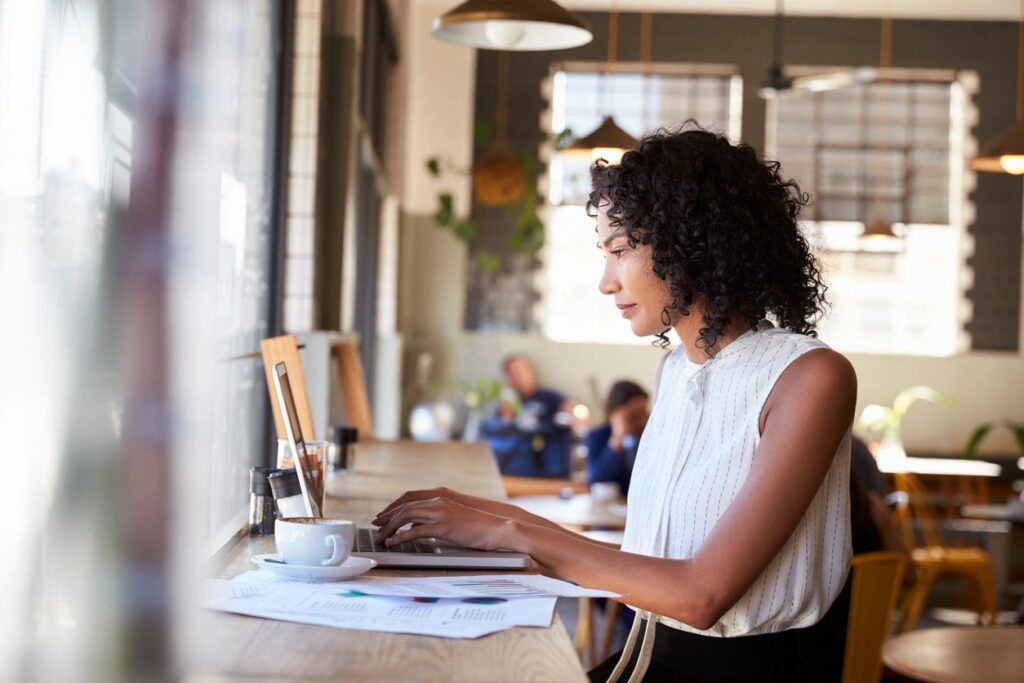 The photo of the female leader shows her preparing a 100-day action plan. In this entrepreneur’s mind, it's all About Results!